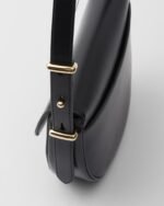 Prada Arqué flip leather shoulder bag